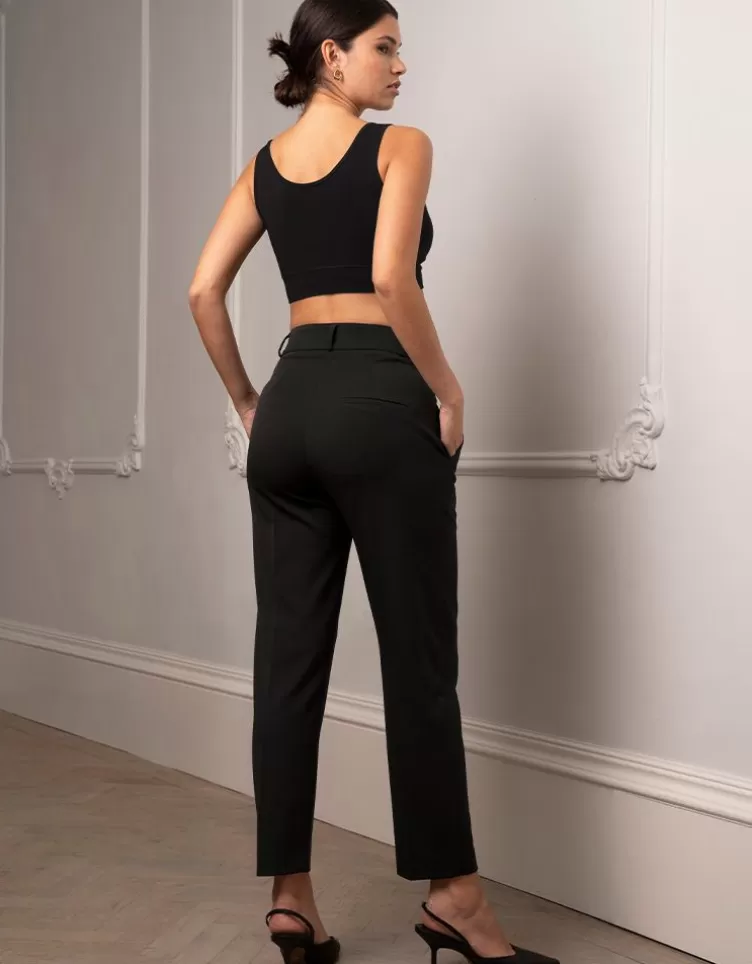 Seraphine Pantalon de grossesse fuselé noir avec bandeau sous le ventre | < Pantalons et jupes