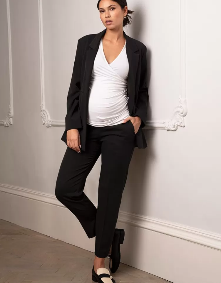 Seraphine Pantalon de grossesse fuselé noir avec bandeau sous le ventre | < Pantalons et jupes